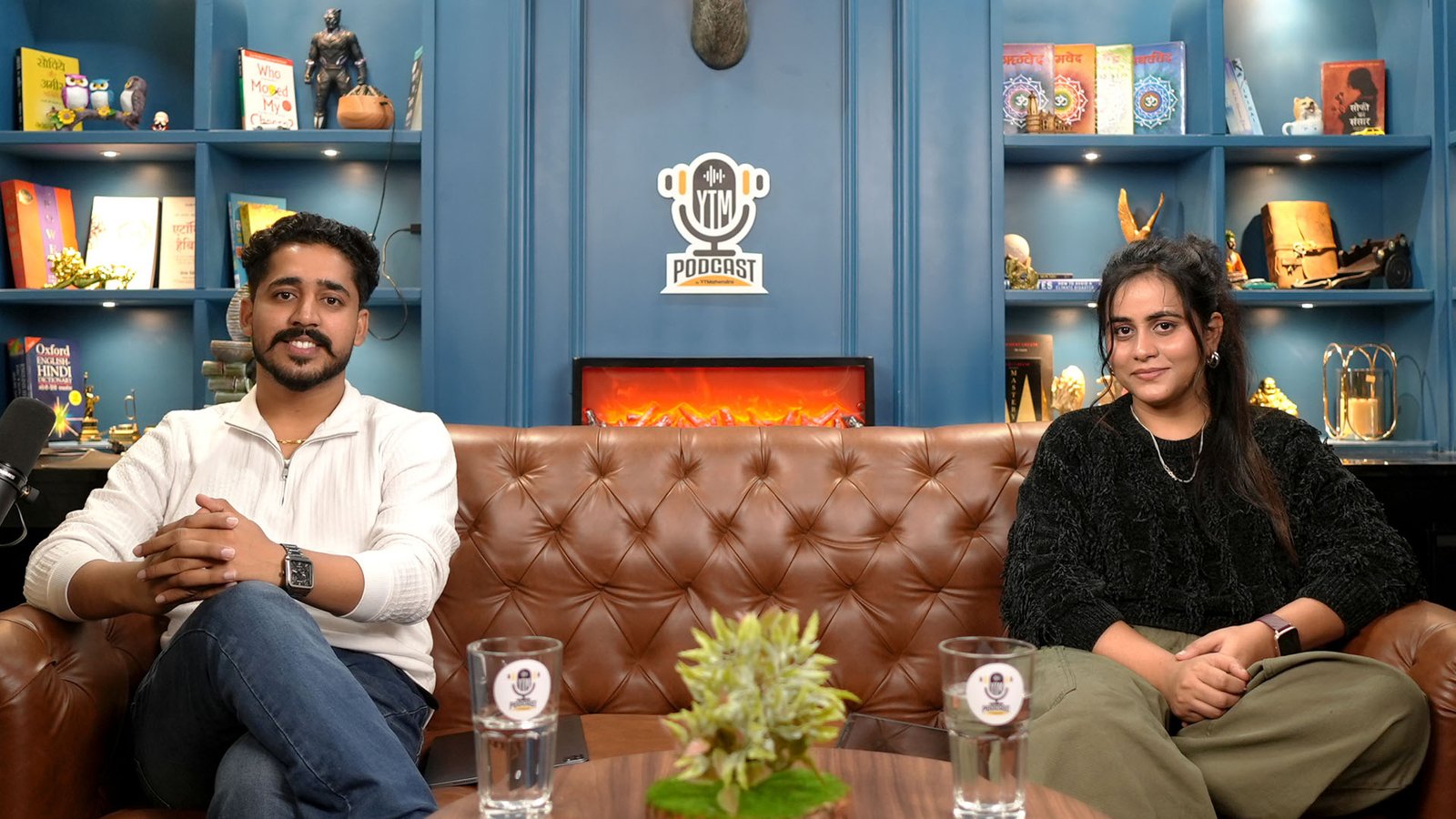 Host and guest recording a conversation podcast on the Blue Theme set at Oskillo Studio, Jaipur