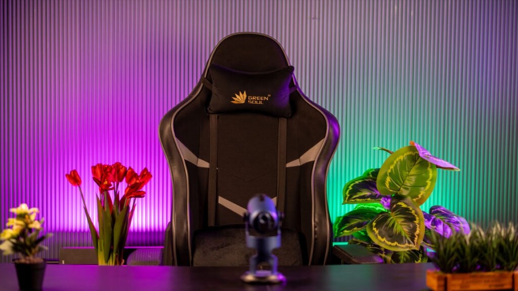 Gaming chair with purple and pink RGB lighting and red tulips in the creator corner
